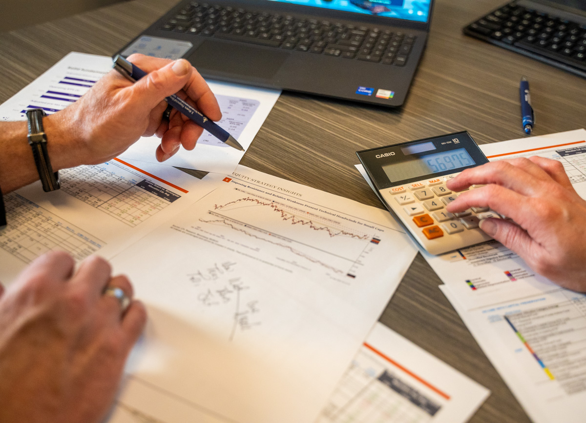 looking over financial papers and charts