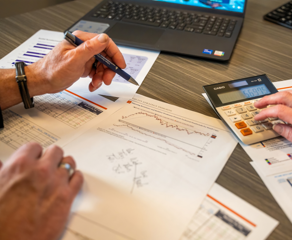 close up view of financial charts and calculator