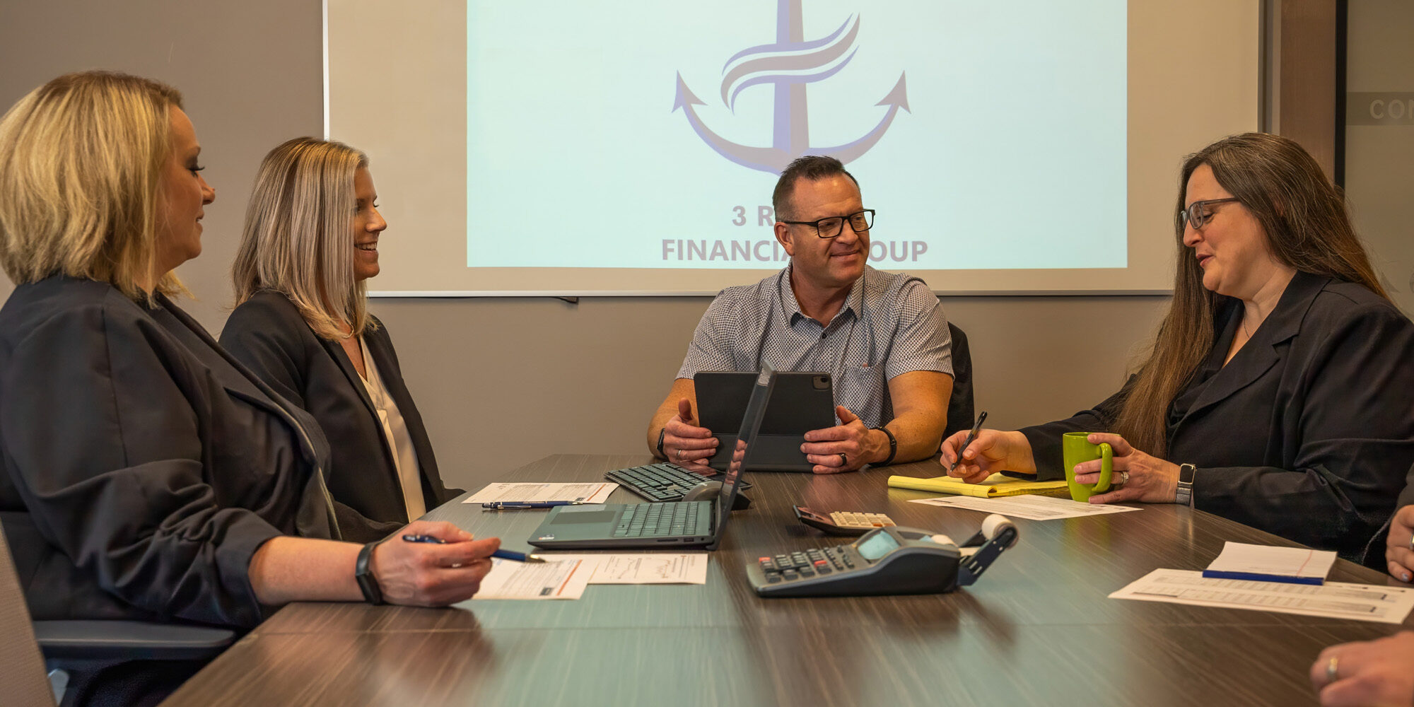 3 Rivers Financial_Website Photoshoot_01.2025-08933_Topaz 3 Rivers Financial Group team working together at a conference room table